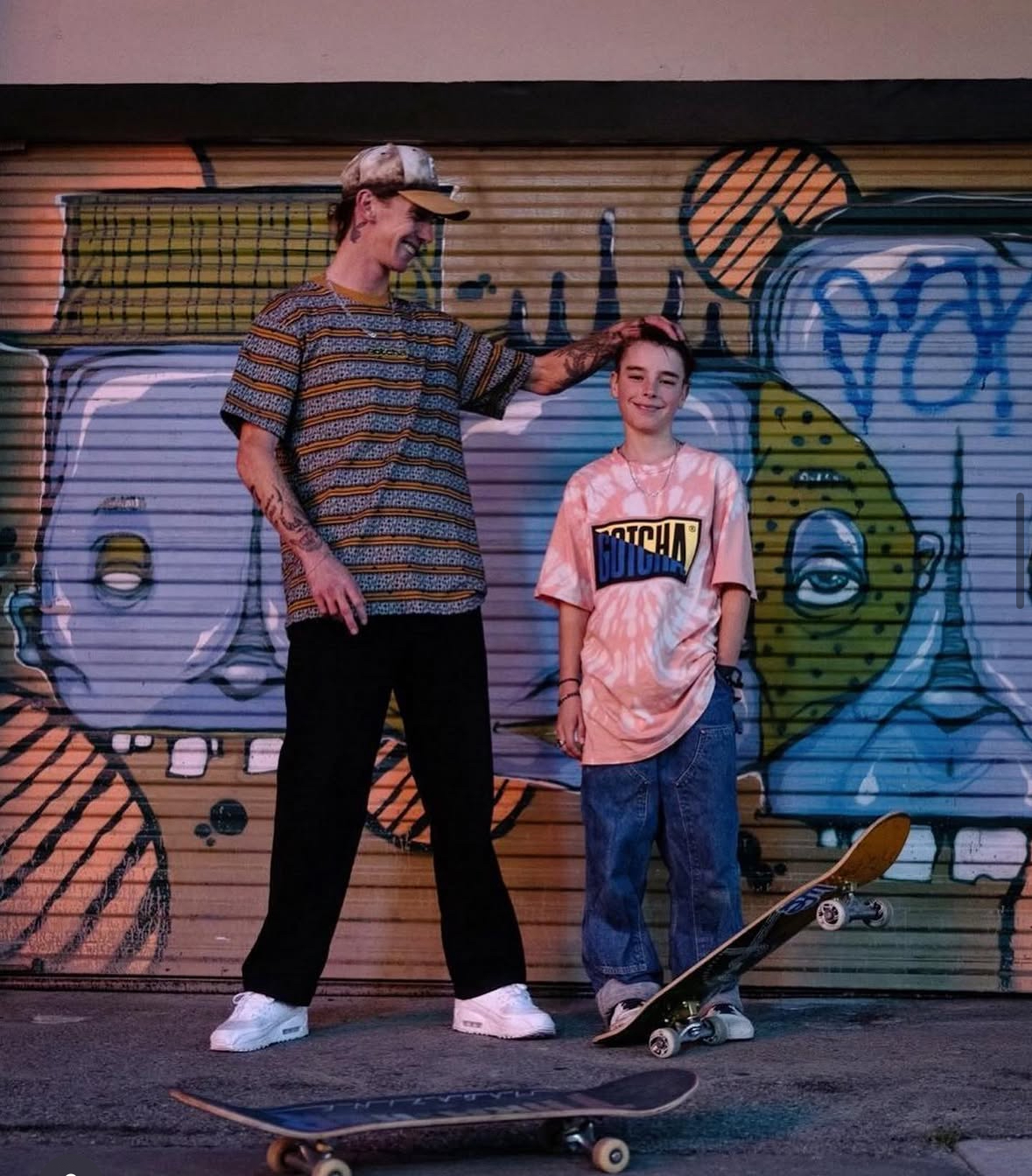 Haden with a student after a progression-focused skateboard lesson.